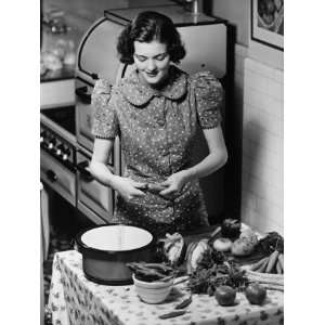  Young Woman Preparing Vegetables in Kitchen, Elevated View 