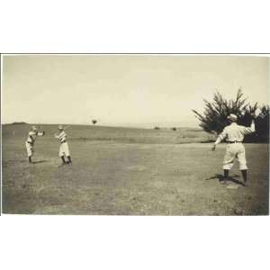   Three boys with a ball and bat, playing One Old Cat