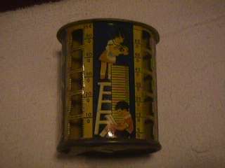 vintage childs tin cylindrical coin bank great graphics  