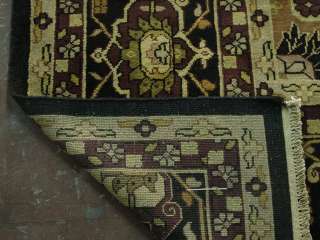   wine surrounded with gold, green black make the rug very decorative