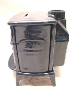 Vermont Castings miniature bank stove in Midnight Blue. Has a chip 